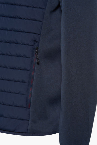 Korte blauwe jas van JACK & JONES, met ritssluiting aan de linkerkant en gewatteerde textuur.