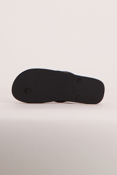 Tongs bleues de ACCESSORIES BY JACK & JONES avec semelle noire texturée, vue du dessous.
