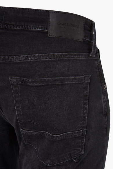 Grijze slim fit jeans van JACK & JONES JEANS INTELLIGENCE met zichtbare achterzak en zwart leren label.