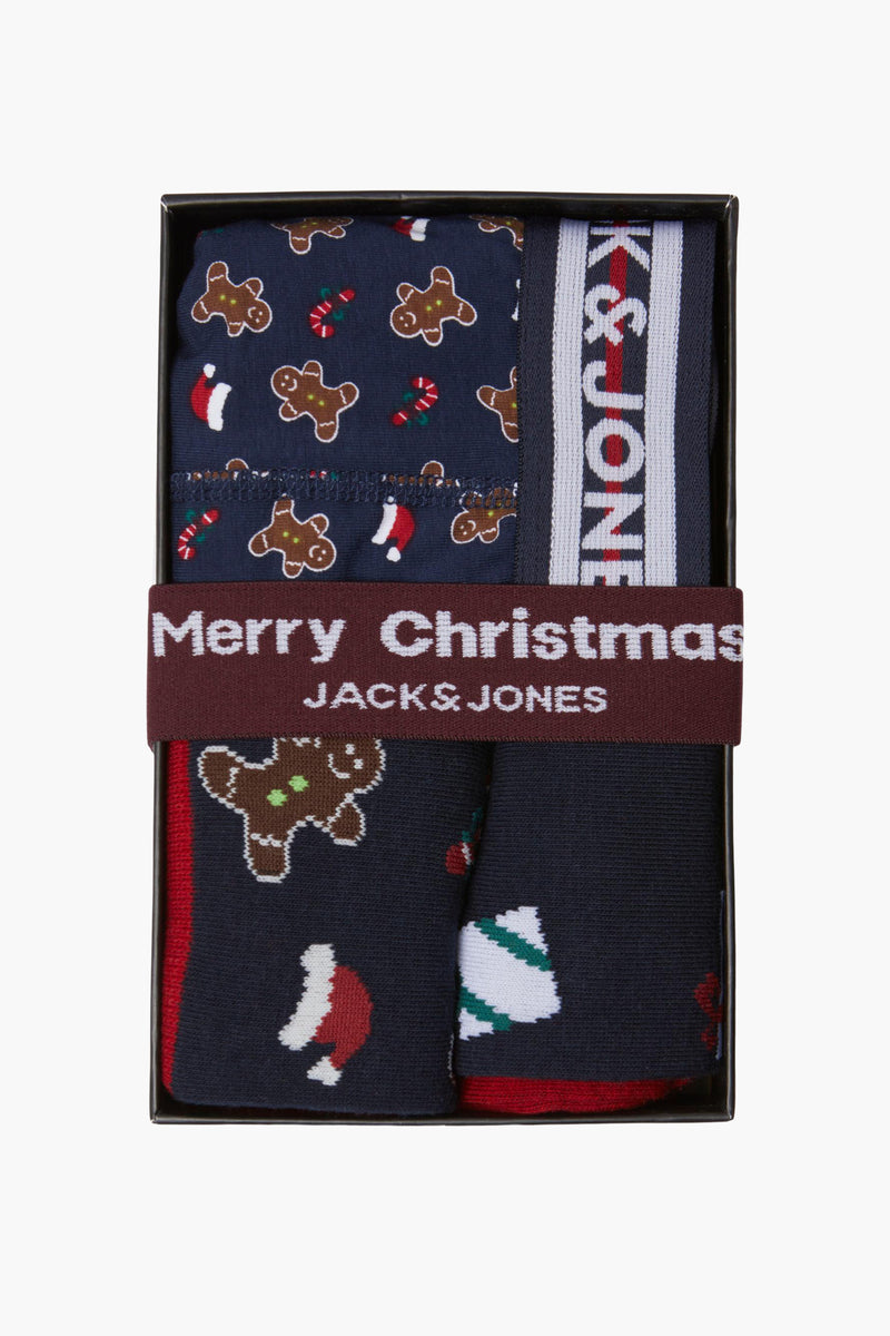 Coffret-cadeaux bleu par ACCESSORIES BY JACK & JONES avec des motifs de bonhomme en pain d'épices, de cannes de Noël et de chapeaux de Père Noël.
