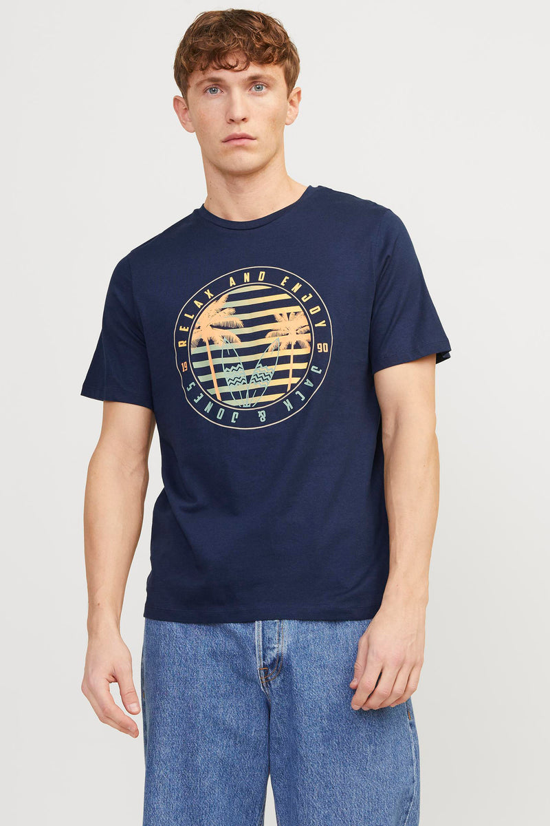 Navy blue short-sleeve t-shirt with circular tropical graphic featuring palm trees and striped sunset, worn by model in front view.