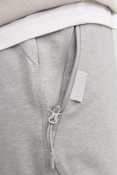 Grijze sportshort JACK & JONES JEANS INTELLIGENCE met zak met rits.