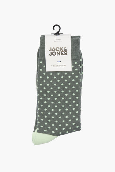 Chaussettes vertes à pois, par ACCESSORIES BY JACK & JONES, présentées sur un cintre noir.