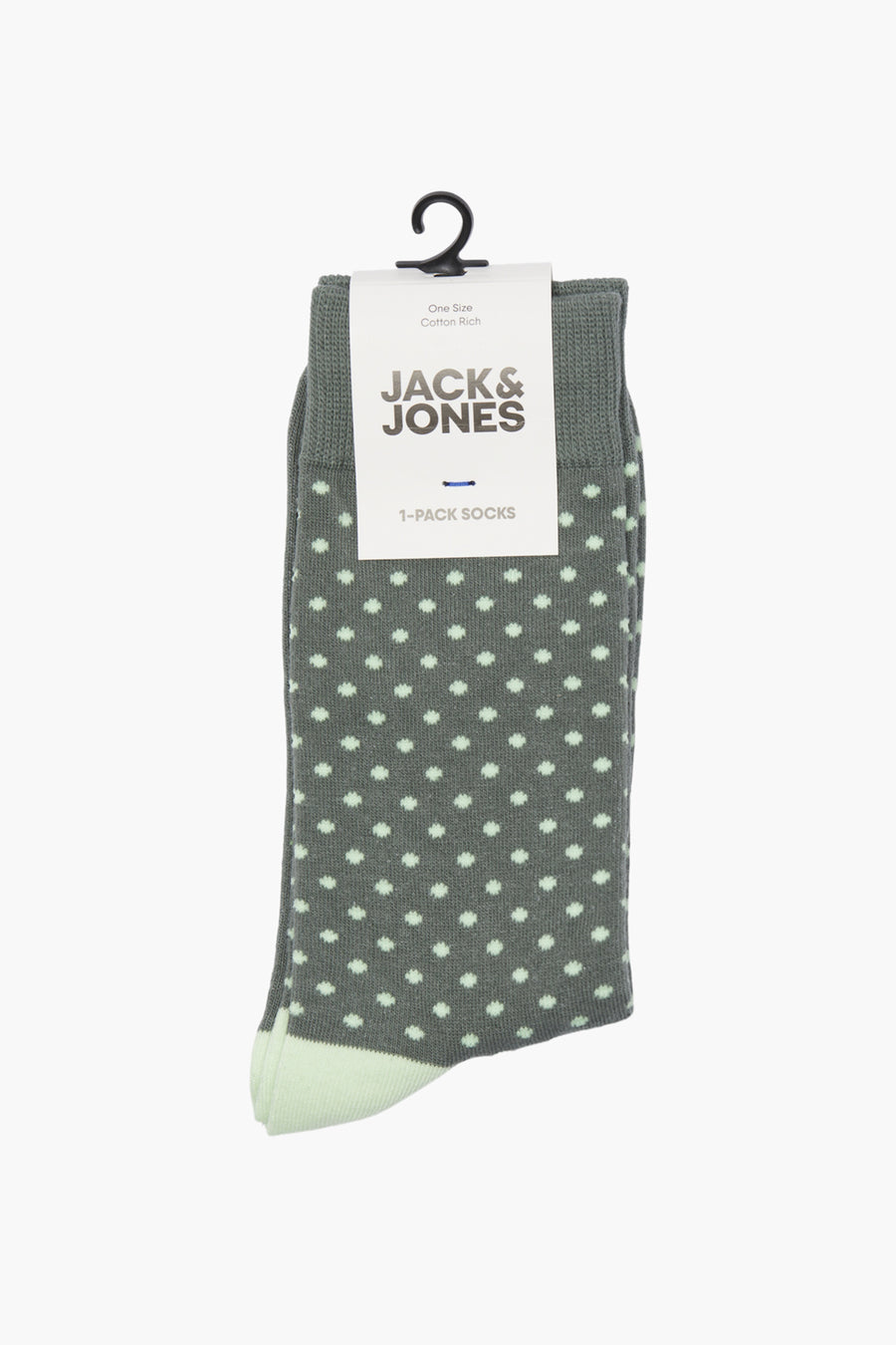 Chaussettes vertes à pois, par ACCESSORIES BY JACK & JONES, présentées sur un cintre noir.