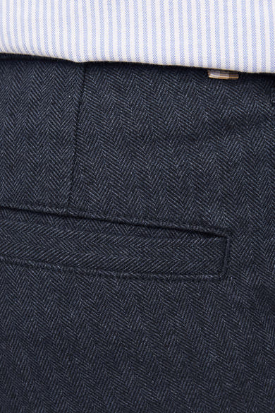 Pantalon de costume bleu de JACK & JONES, à motif chevron discret et poche arrière passepoilée.