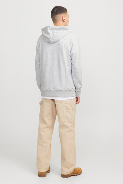 Zwembroak met eens jackacSSSSSS & & & & & &,-shirt shirt enen witte t-shirt en een beige broek, vanachens.
