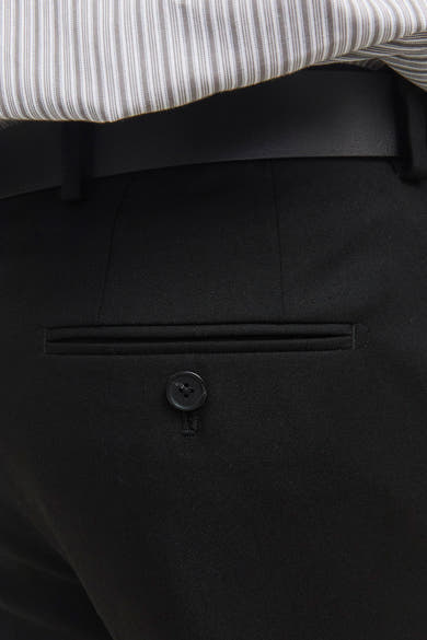 Pantalon de costume noir de PREMIUM by JACK & JONES, poche boutonnée au dos et rayures de chemise apparentes.