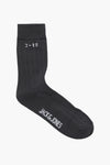 Chaussette grise par ACCESSORIES BY JACK & JONES, avec motif de côtes verticales et logo imprimé.
