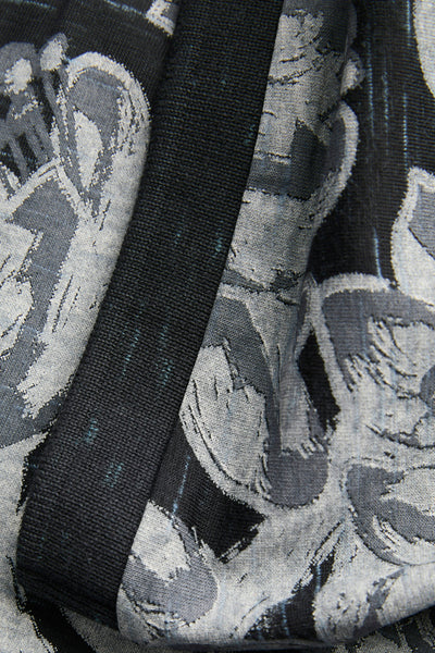 Zwart poloshirt met korte mouwen van ORIGINALS BY JACK & JONES, gebreide textuur met grijs en zwart bloemenpatroon.