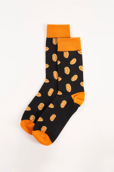 Chaussettes noires à motifs orange par Accessories by Jack & Jones, avec bordure et bout unis.