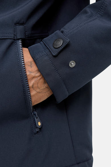 Veste courte bleue de PREMIUM BLUE by JACK & JONES, avec fermeture éclair et détail de bouton sur la manche.
