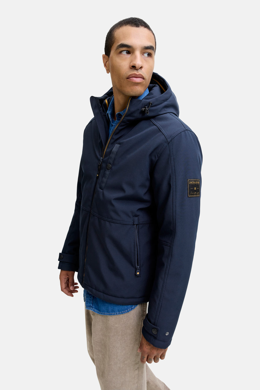 Veste courte bleue de PREMIUM BLUE by JACK & JONES avec capuche, fermeture éclair et poches à fermeture éclair.
