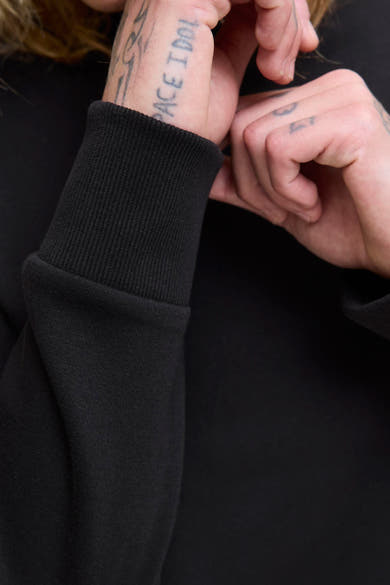 Sweat-shirt noir de Originals by Jack & Jones, avec bord côte texturé au poignet.