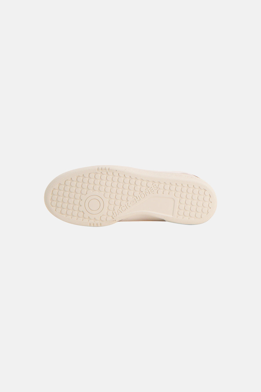 White low-top sneaker by Jack & Jones, showing textured rubber sole with circular tread pattern and brand embossing, bottom view.