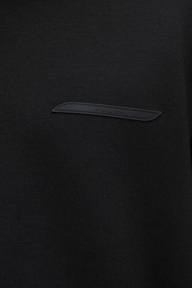Zwarte hoodie van JACK & JONES met decoratief inzetstuk van imitatieleer.