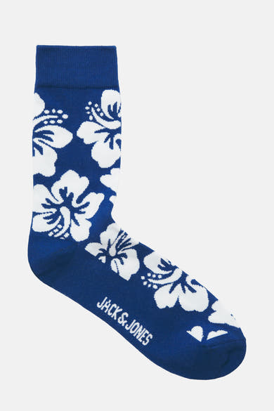 Chaussette bleue de ACCESSORIES BY JACK & JONES avec motif floral blanc et logo de la marque sur le côté.