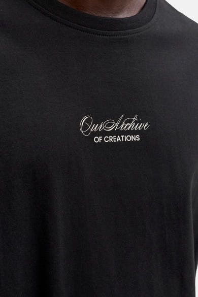 T-shirt noir de ORIGINALS BY JACK & JONES avec broderie blanche « Our Archive OF CREATIONS ».