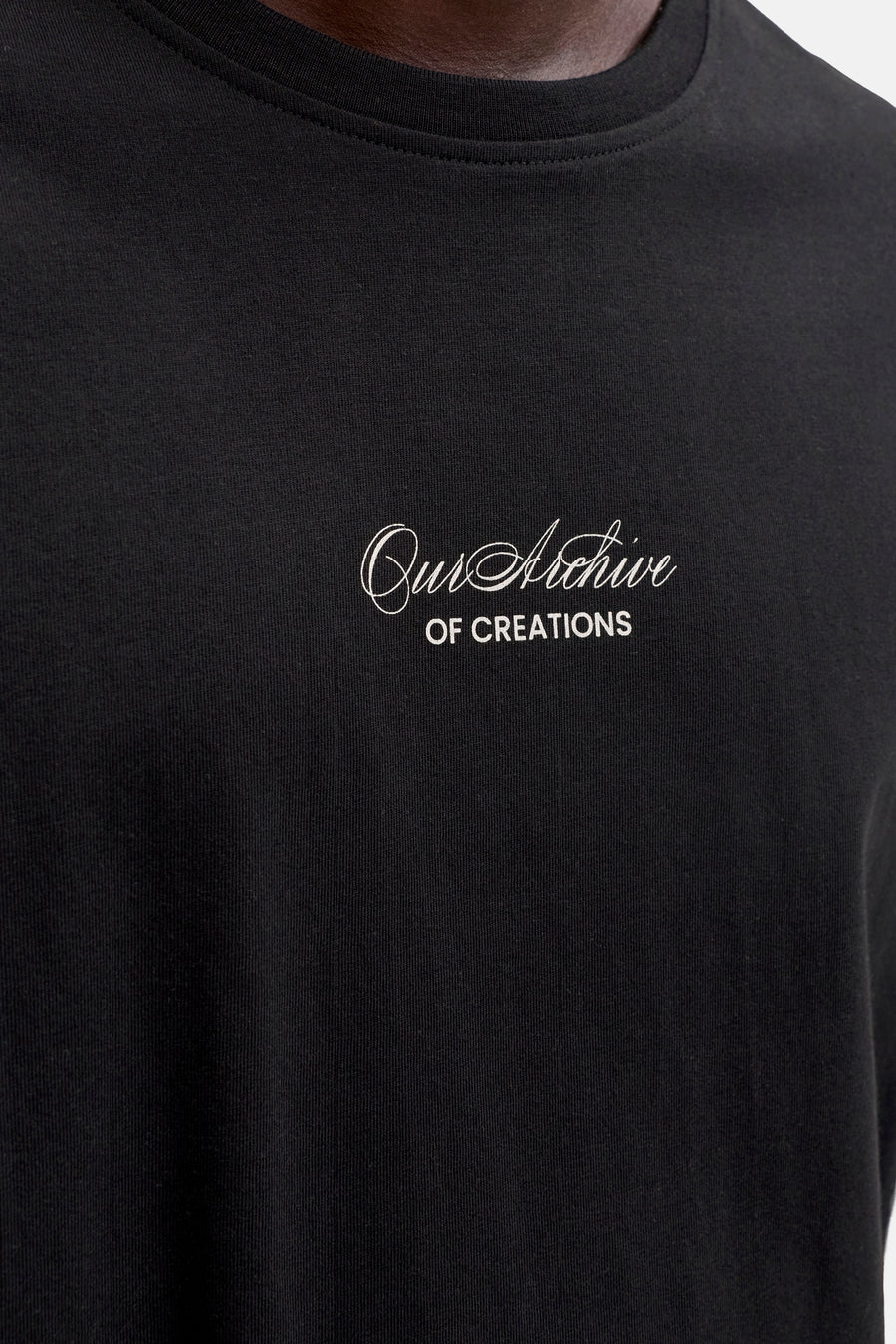 T-shirt noir de ORIGINALS BY JACK & JONES avec broderie blanche « Our Archive OF CREATIONS ».