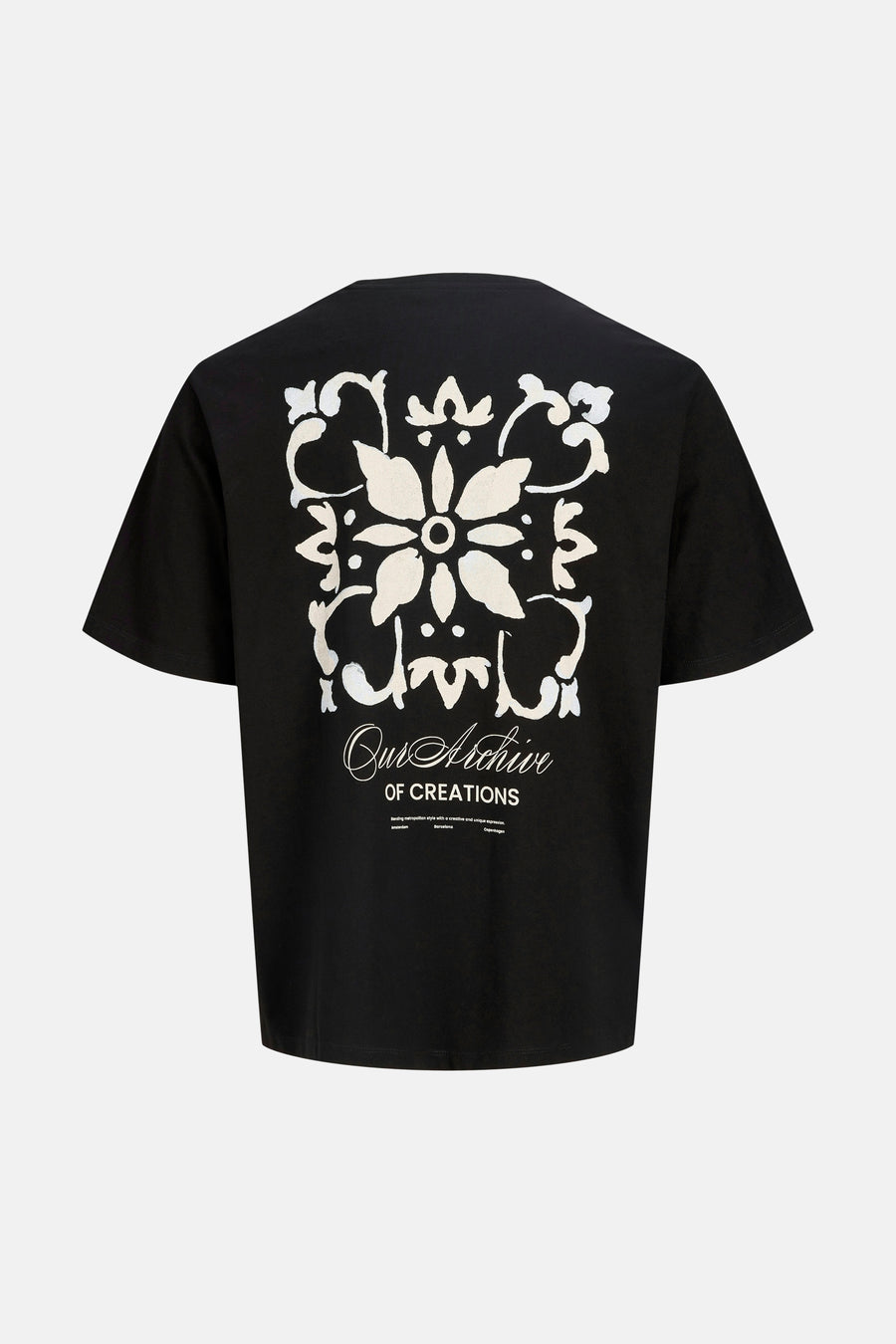 T-shirt noir d'ORIGINALS BY JACK & JONES avec un grand motif floral blanc et le texte "Our Archive OF CREATIONS" au dos.