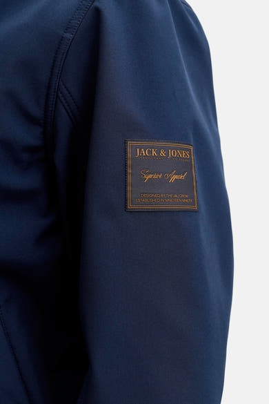 Veste de pluie bleue d'ORIGINALS BY JACK & JONES, avec écusson décoratif sur la manche.
