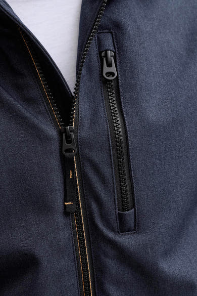Veste courte bleue de ORIGINALS BY JACK & JONES avec fermetures éclair noires et surpiqûres jaunes.
