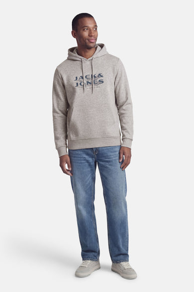 Sweat à capuche gris de PREMIUM by JACK & JONES, porté avec un jean bleu et des baskets grises.