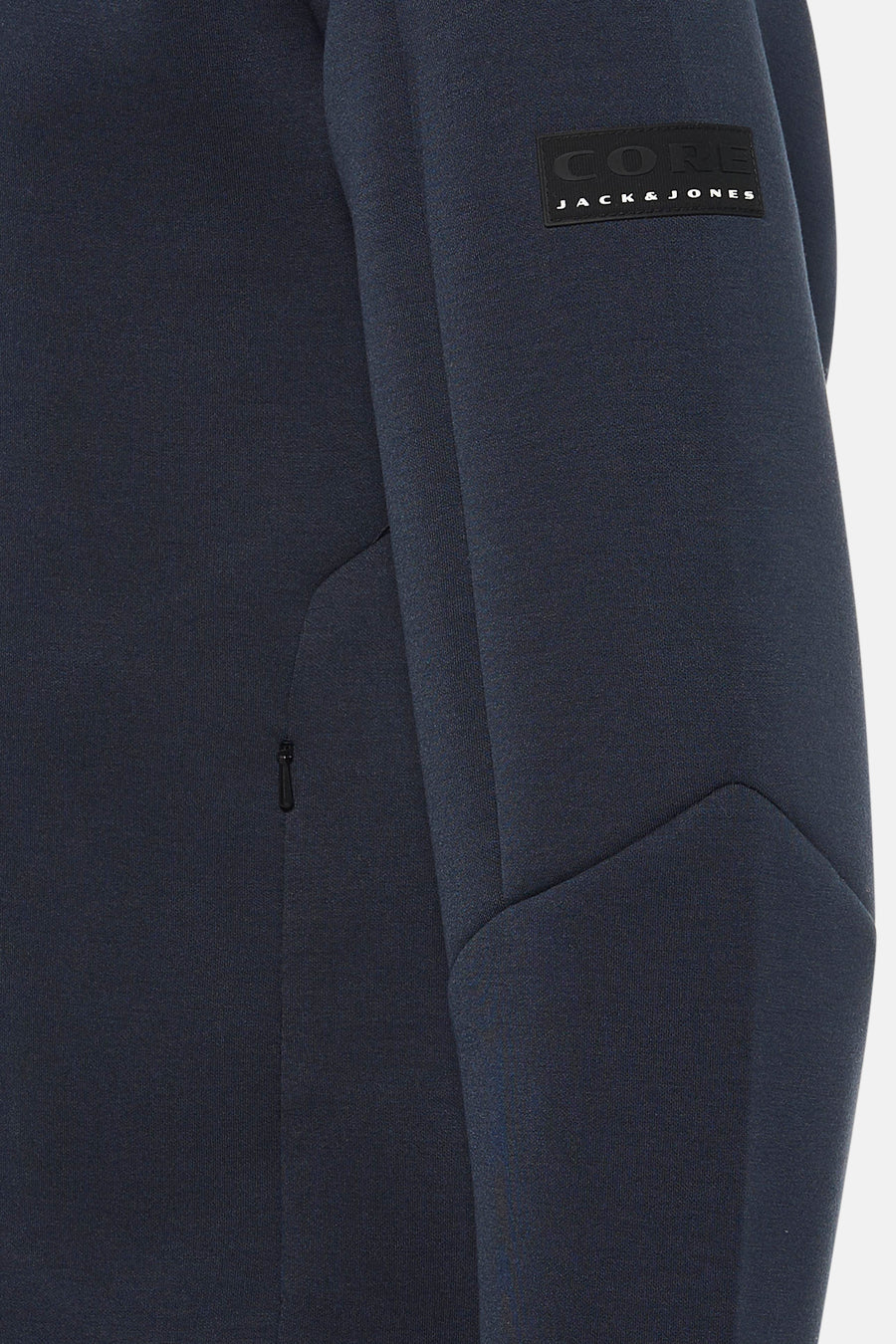 Korte blauwe jas van JACK & JONES, met discrete ritssluiting aan de zijkant en logo op de mouw.