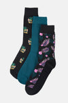 Pack de chaussettes multicolores d'ACCESSORIES BY JACK & JONES : une paire noire à motifs de crânes ananas, une unie bleu sarcelle, et une noire à fleurs roses et feuilles tropicales.