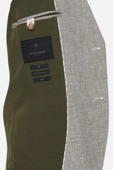 Blazer vert coupe slim de JACK & JONES PREMIUM, vue intérieure avec doublure olive et tissu extérieur texturé.