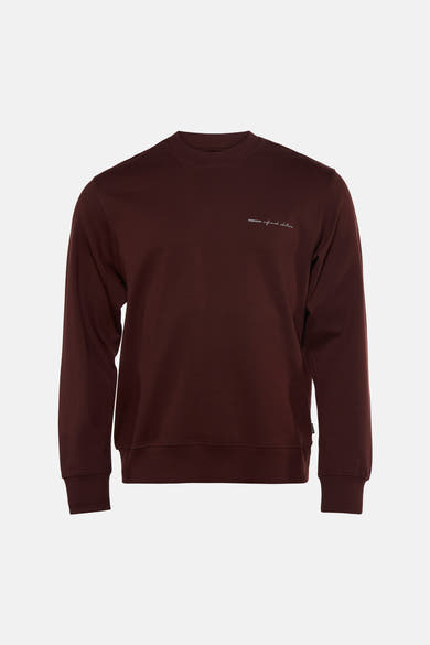 Brown crewneck sweatshirt with ribbed cuffs and hem, featuring small white embroidered text on chest, front view