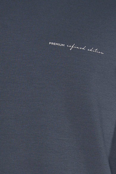 Navy blue crewneck sweatshirt with white embroidered "PREMIUM refined edition" text on chest, close-up view
