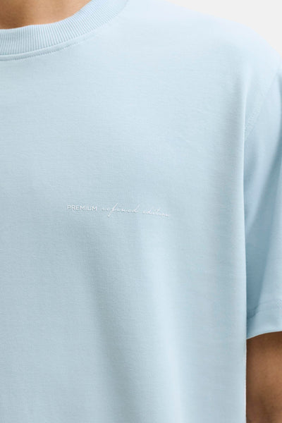 T-shirt à manches courtes bleu de PREMIUM by JACK & JONES avec un texte décoratif brodé.