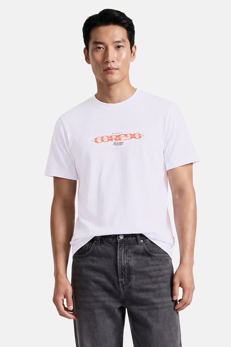 White short-sleeve t-shirt with orange chain graphic and small text details, worn by model with dark jeans, front view