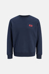 Navy blue crewneck sweatshirt by Jack & Jones with red logo patch on chest, ribbed cuffs and hem, front view