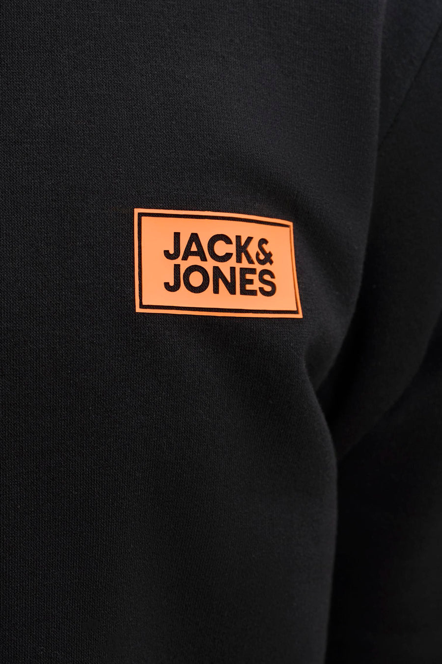 Black hooded sweatshirt by Jack & Jones featuring orange rectangular logo patch on chest, close-up view.