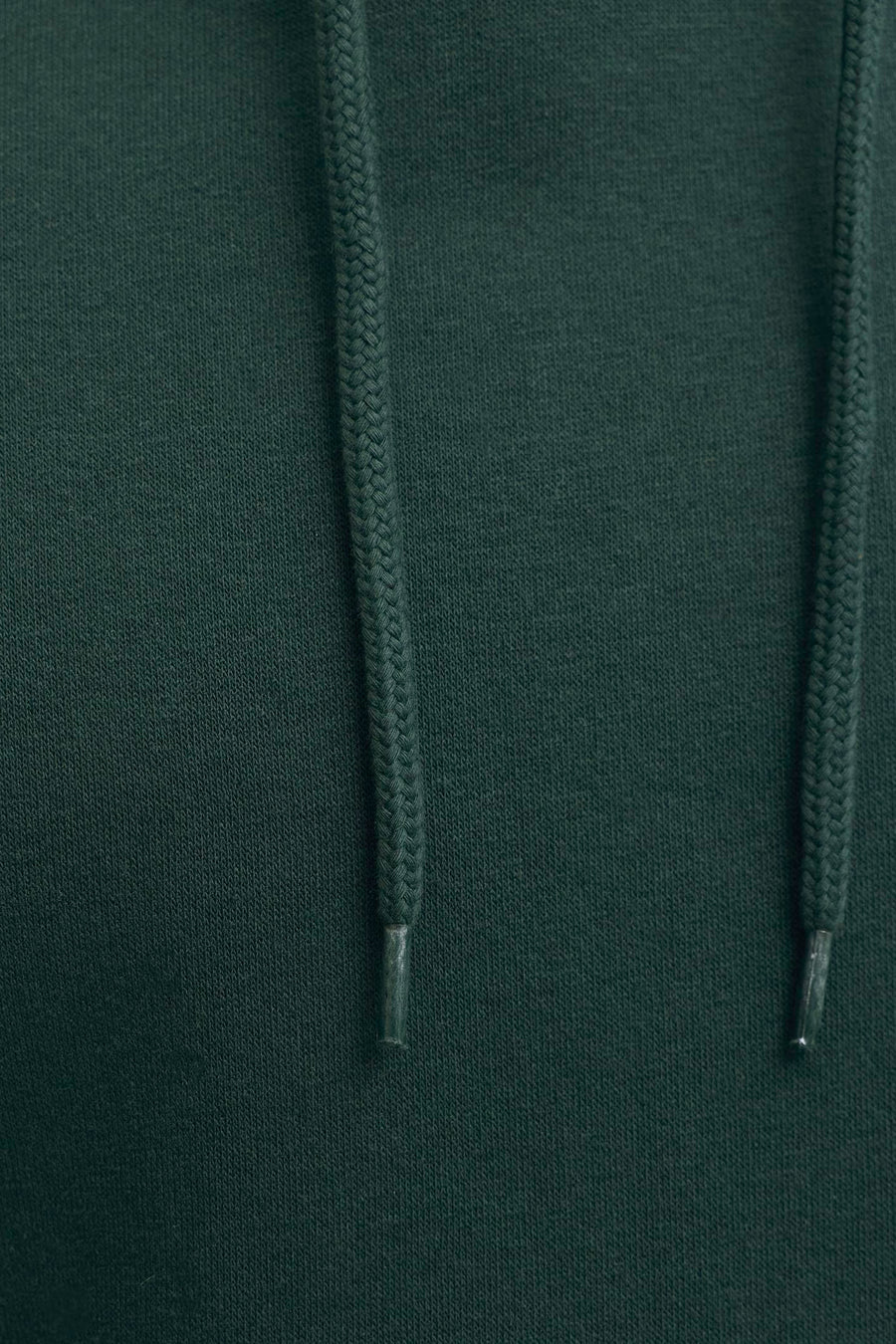 Dark green hooded sweatshirt with textured knit fabric and braided drawstrings, close-up front view