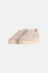 Beige suede sneakers by Jack & Jones with white laces, side logo, and textured rubber sole, front view