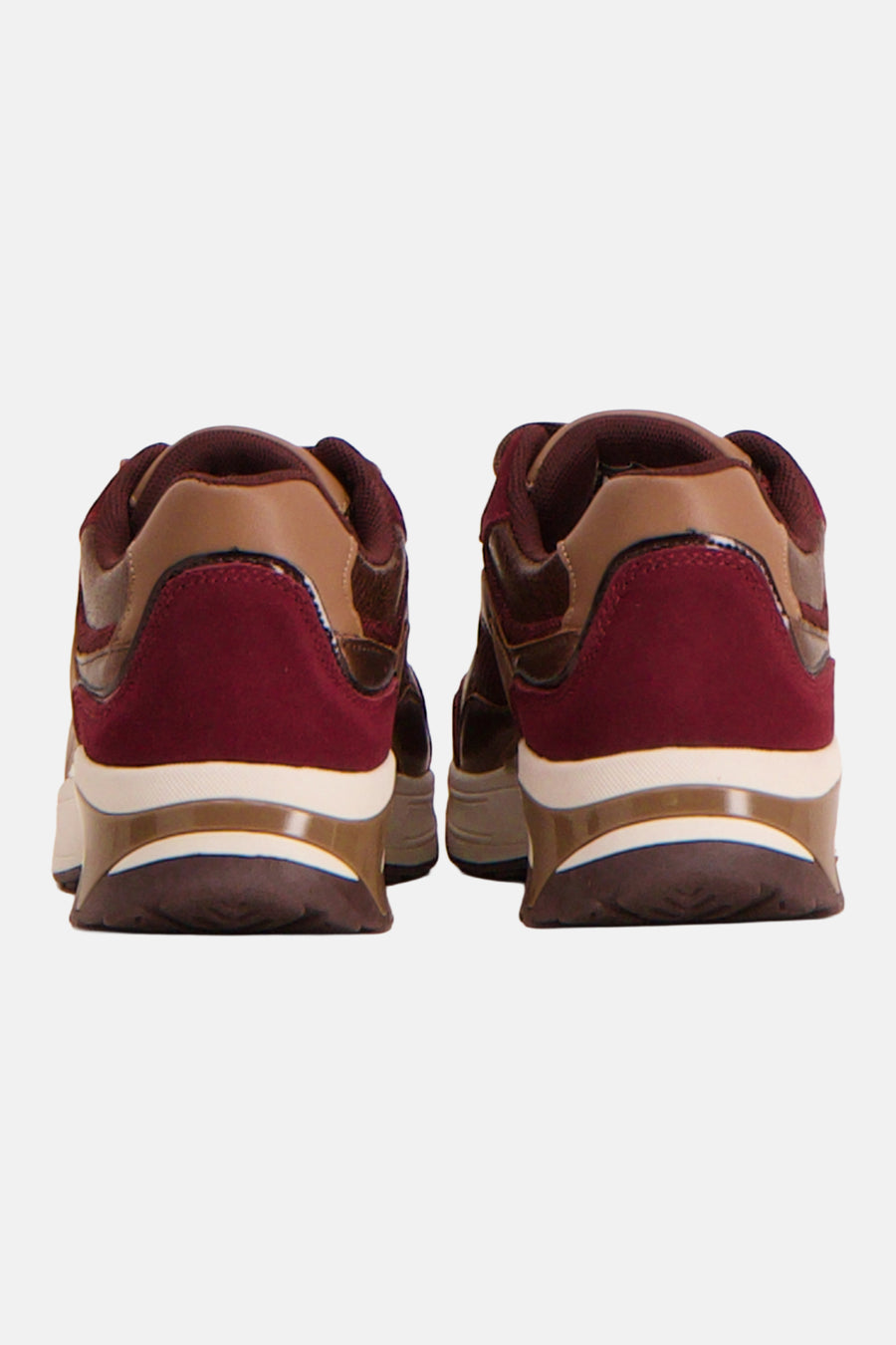 Burgundy suede and tan leather sneakers from back view, featuring white midsole and translucent heel accent