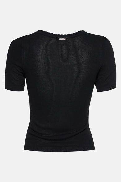 Pull noir à col rond de GOA GOA, en maille fine et coupe ajustée, présenté de dos.