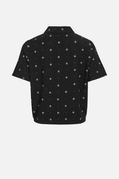 Zwart T-shirt met korte mouwen van VILA® met een wit geometrisch patroon over het geheel.