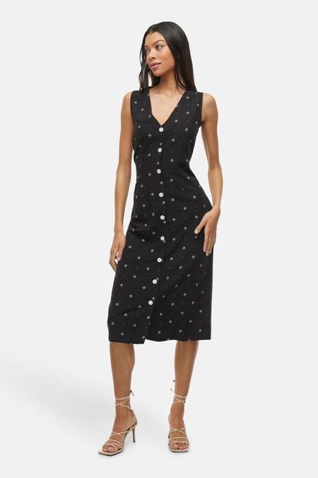 Robe noire à boutons de VILA®, avec motif géométrique subtil et coupe mi-longue.
