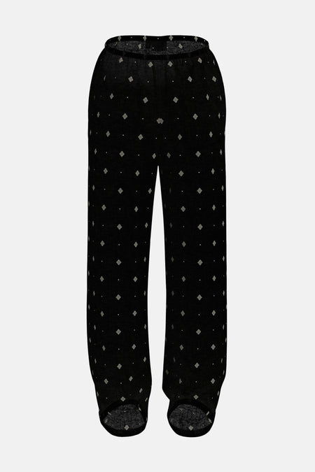 Pantalon noir à motifs de VILA®, avec motif losange blanc sur l'ensemble.