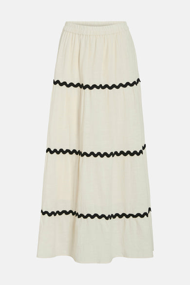 Jupe longue beige de VILA®, à volants et ornée de détails noirs ondulés.