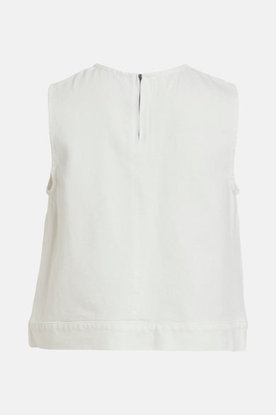 Blouse blanche en denim de VILA, avec fermeture éclair visible au dos.