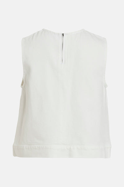 Blouse blanche en denim de VILA, avec fermeture éclair visible au dos.
