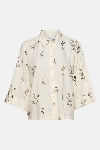 Beige blouse met lange mouwen van VILA®, versierd met delicate bloemenborduursels over het hele oppervlak.