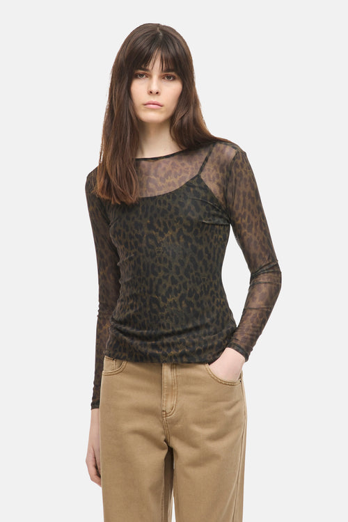 Multicolored long-sleeve leopard-print sheer top with round neckline, worn with beige pants, front view