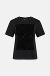 Zwart T-shirt met korte mouwen van VILA, van achteren gezien, op een witte achtergrond.