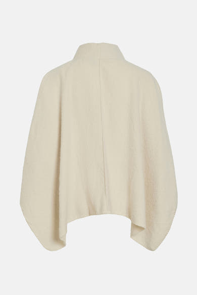 Beige poncho van VILA, met een zachte textuur en een opstaande kraag, van achteren gezien.