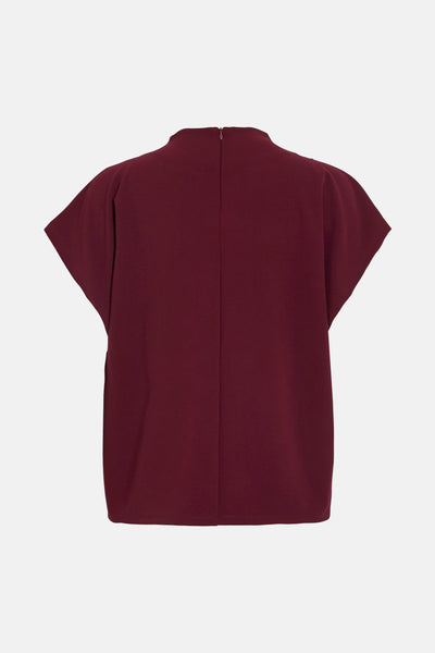 Blouse bordeaux à manches courtes de VILA®, avec fermeture éclair discrète au dos.
